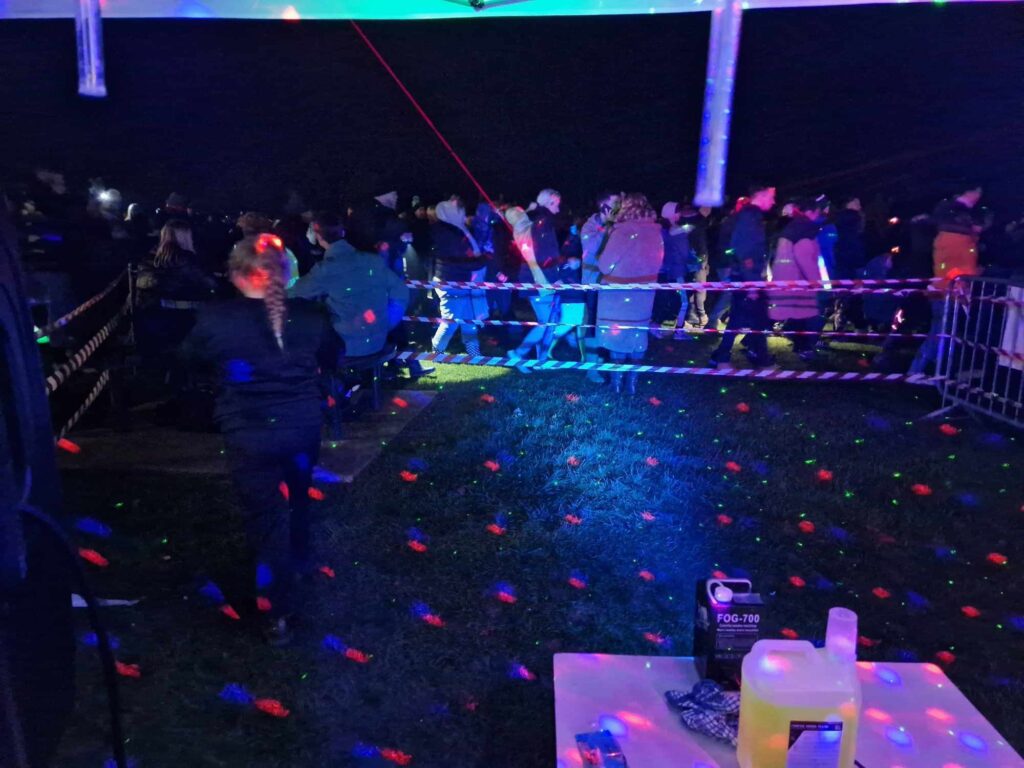 People dancing at RockinDaddysRadio.com at the Martock Fire Work Event in November 2023