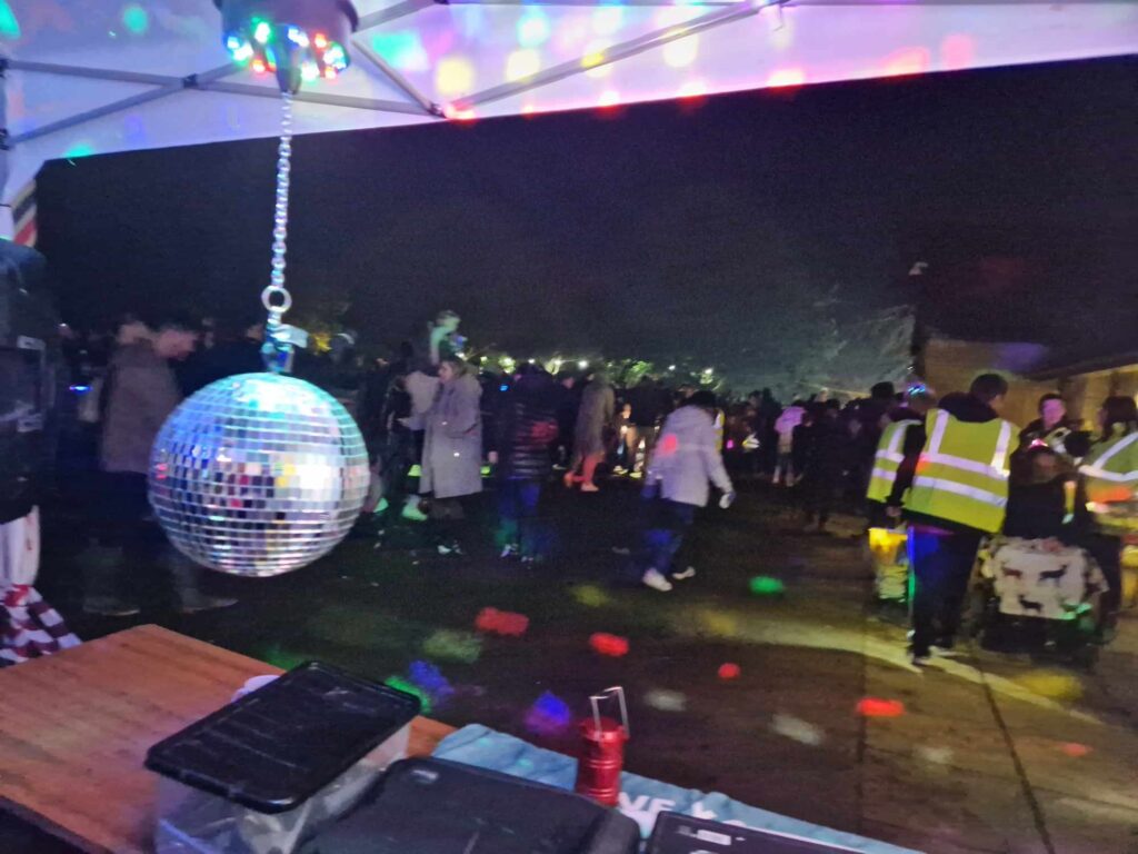 People dancing at RockinDaddysRadio.com at the Martock Fire Work Event in November 2023